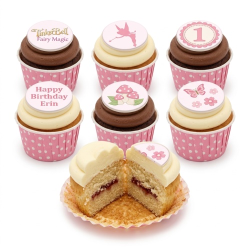 TinkerBell themed cupcakes with fairy, mushroom, butterfly, and custom age/name toppers in pink polka dot cases.