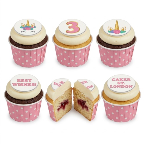 Unicorn themed birthday cupcakes with white icing, pink polka dot wrappers, and custom age topper.