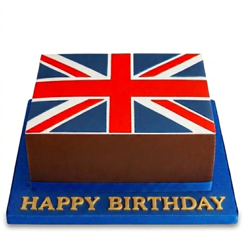 Rectangular Union Jack birthday cake with red, white, and blue flag design on top, brown sides, and 'Happy Birthday' in gold on a blue board.