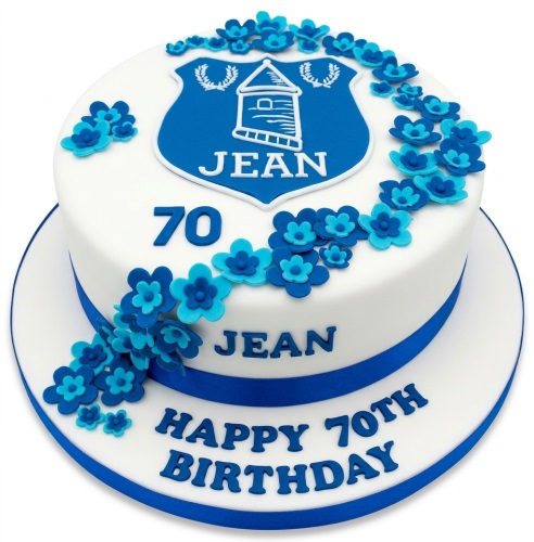 Round white cake with blue Everton FC crest, blue sugar flowers, and blue ribbon.