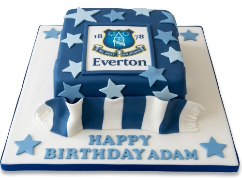 Square blue fondant cake with Everton FC crest, blue stars, and a blue and white striped scarf.