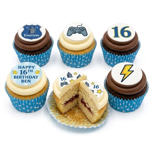 Six cupcakes with blue polka dot cases, topped with gaming controller, Everton crest, lightning bolt, and custom age toppers.