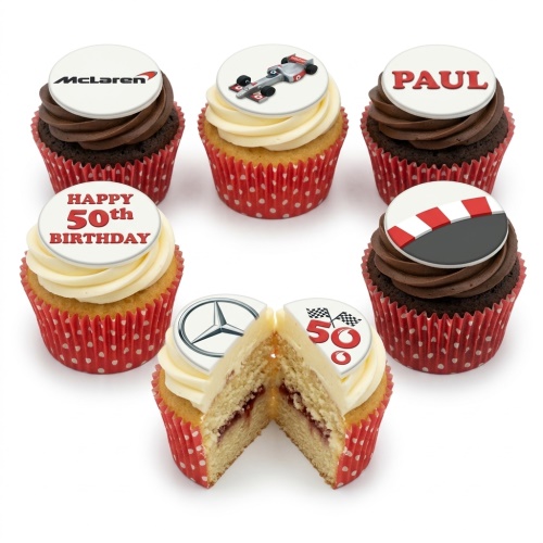 Assortment of racing car themed birthday cupcakes with car brand logos and custom age toppers.