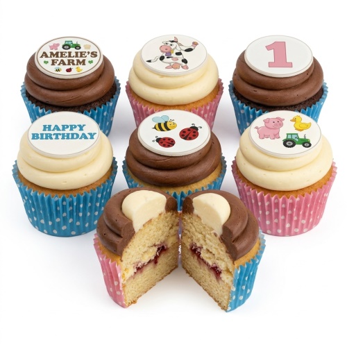 Selection of farm animal themed birthday cupcakes with chocolate and vanilla frosting, some with custom age and happy birthday toppers.
