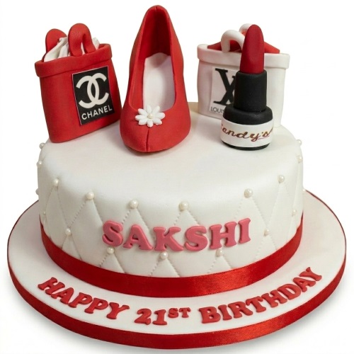 White birthday cake with red high heel, handbag, and lipstick decorations, featuring a quilted pattern and custom age.