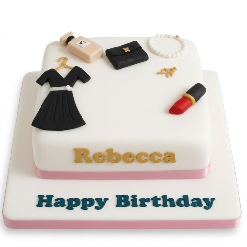 Two-tier white birthday cake with black dress, handbag, perfume, pearl bracelet, and red lipstick decorations.