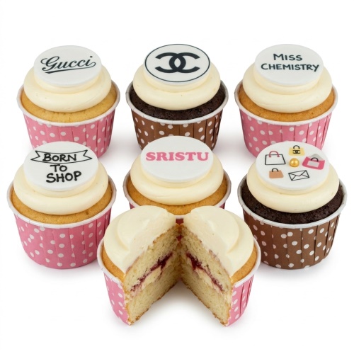 Vanilla and chocolate cupcakes with white frosting, topped with edible designer brand logos, shopping bags, and custom messages.