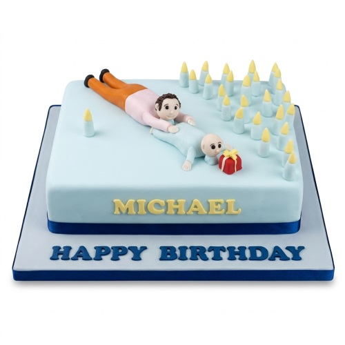 Square light blue fondant cake with a man pushing a baby figure, surrounded by numerous yellow-tipped candles and a red gift box.