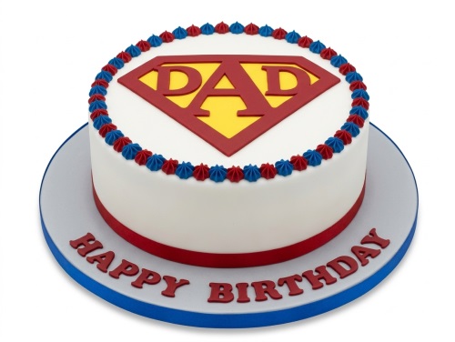 Round white birthday cake with a red and yellow 'DAD' superhero shield and red and blue piping.