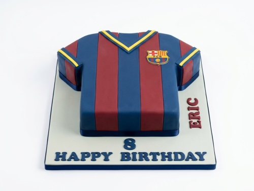 FC Barcelona football shirt birthday cake with red and blue stripes, FCB logo, and custom age.