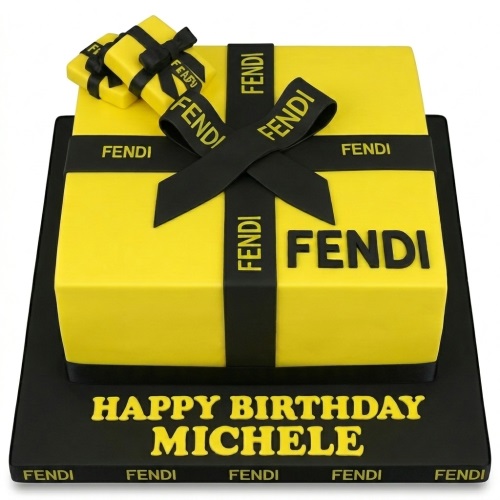 Yellow Fendi gift box birthday cake with black ribbons and logo, personalised with a custom message.