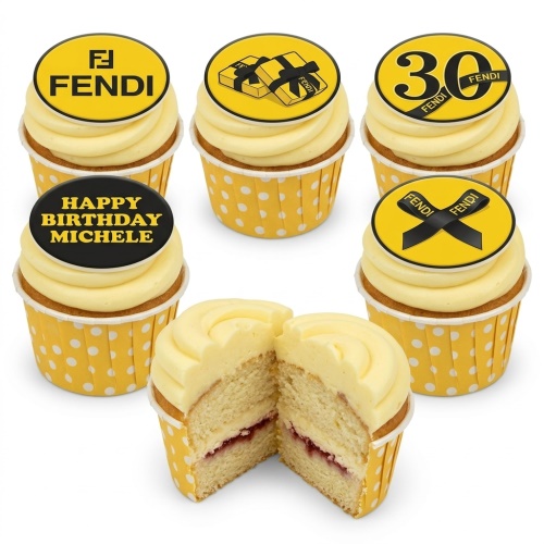 Fendi themed cupcakes with yellow frosting, Fendi logo, gift box, ribbon, and custom age toppers
