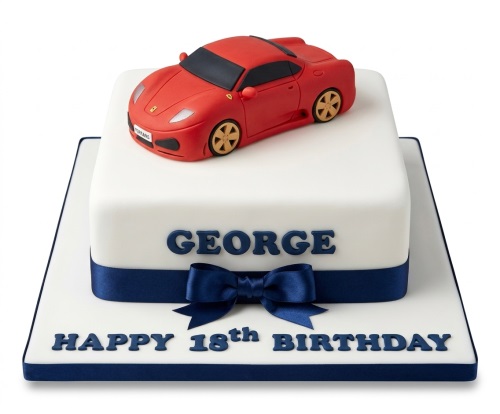 White square birthday cake with a red Ferrari sports car, blue ribbon, and custom message on the board.