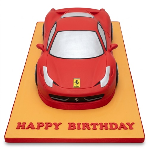 Red Ferrari sports car birthday cake on an orange board with 'Happy Birthday' message.