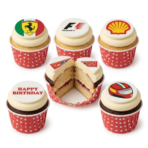 Set of Formula 1 themed birthday cupcakes with racing logos and helmet toppers in red polka dot cases.