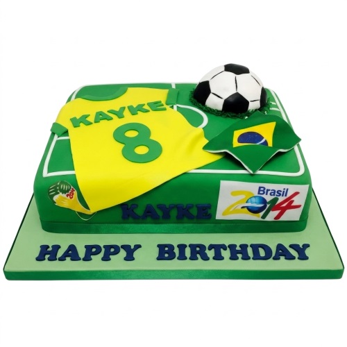 Green football pitch cake with yellow Brazil jersey, football, and flag. Happy Birthday message on board.