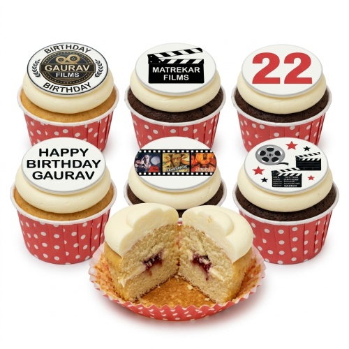 Assortment of film theme birthday cupcakes with clapperboard, film reel, and custom age toppers.