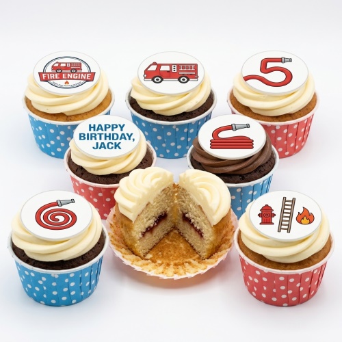 Fire engine themed birthday cupcakes with red and blue cases, featuring fire truck, hose, hydrant, and flame toppers.