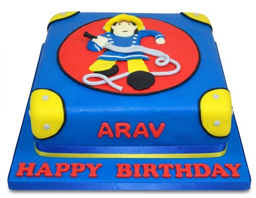 Blue square birthday cake with a 3D Fireman Sam figure on a red circle, yellow corner details, and a custom name and message.