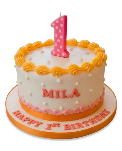 White round 1st birthday cake with pink number one candle, yellow swirls, and pink piped details.