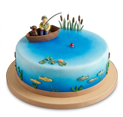 Round blue fishing theme birthday cake with a fisherman in a boat and fish decorations.