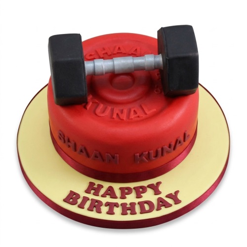 Red gym themed birthday cake with a black and grey dumbbell topper and 'Happy Birthday' message on the board.