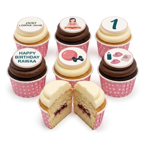 Assortment of fitness and wellness themed cupcakes with pink polka dot wrappers.