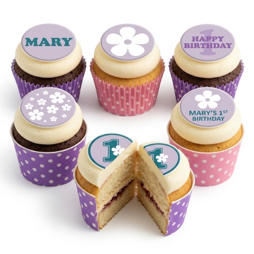 Six floral 1st birthday cupcakes for girls with daisy toppers and custom name.
