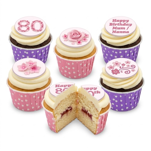 A set of pink and purple floral birthday cupcakes with custom age and message toppers.