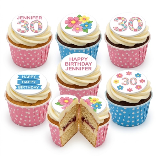 Vanilla and chocolate cupcakes with white buttercream, edible floral toppers, and custom age/message.