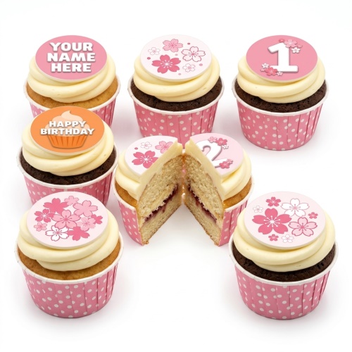 Pink and white floral birthday cupcakes with custom age and name toppers.