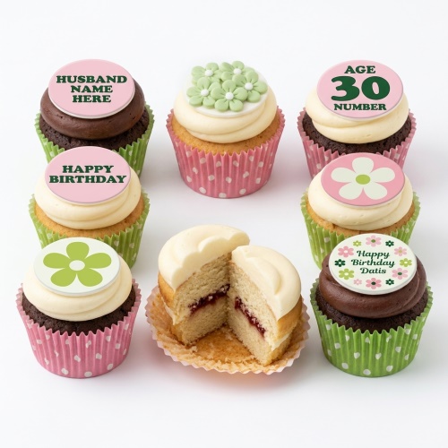Assortment of personalised floral birthday cupcakes with custom age and name toppers.