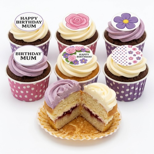 Assortment of floral birthday cupcakes with pink and purple buttercream and custom message toppers.
