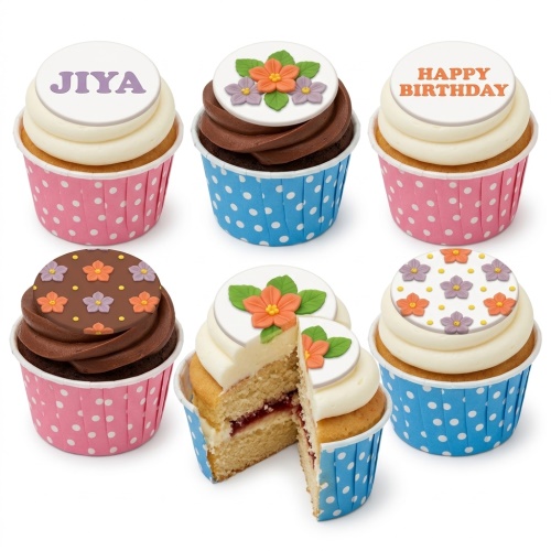 Assortment of floral birthday cupcakes with white and chocolate frosting, decorated with orange and purple sugar flowers.