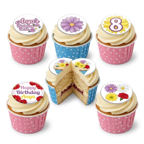 Vanilla cupcakes with white frosting, decorated with edible floral toppers and custom age or name examples.