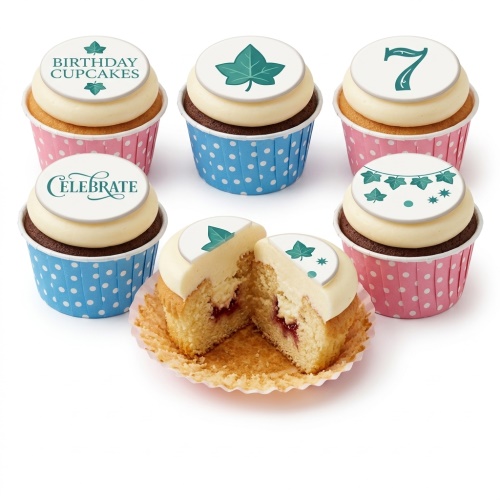 Six cupcakes with white frosting, ivy leaf toppers, and custom age '7' on pink and blue polka dot wrappers.