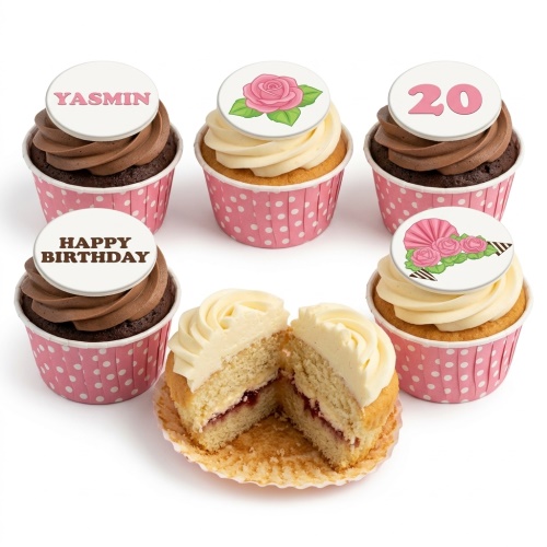 Assortment of floral birthday cupcakes with rose designs, custom age, and message toppers in pink wrappers.
