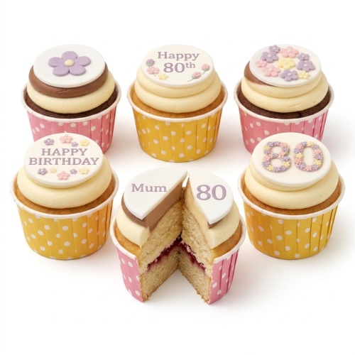 Assortment of floral birthday cupcakes with custom age and 'Happy Birthday' toppers in pastel colours.