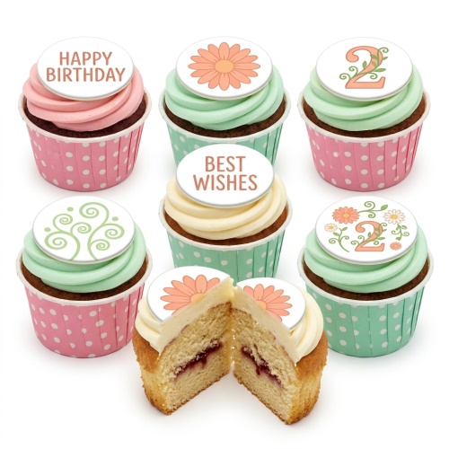 Assortment of floral birthday cupcakes with pastel frosting and custom age and message toppers.
