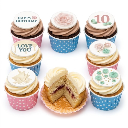 Assortment of floral and celebration cupcakes with custom age topper and messages.
