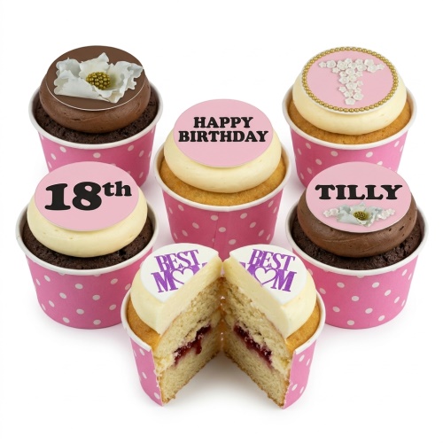 Pink and white personalised birthday cupcakes with custom age, name, message, and floral toppers.
