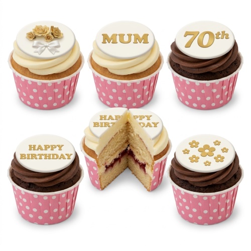 Cupcakes with gold floral and text toppers, cream and chocolate frosting, in pink polka dot wrappers.