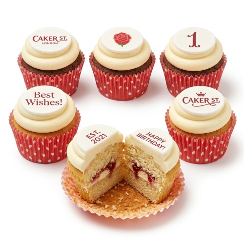 Six cupcakes with white frosting, red polka dot wrappers, and white fondant toppers with a red rose, custom age, and messages.