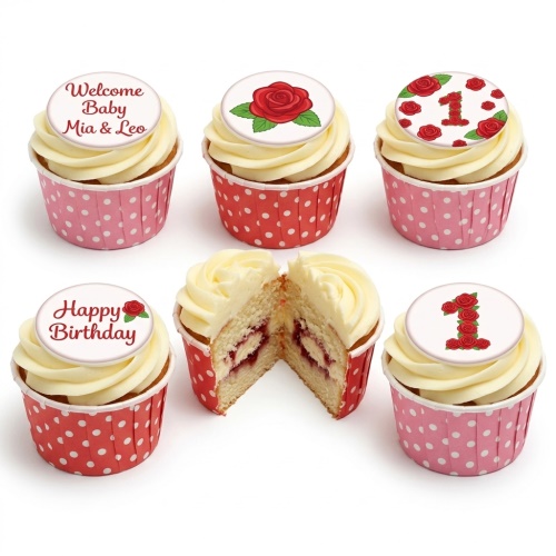 Cupcakes with white frosting and edible red rose toppers, some forming number 1, in pink and red polka dot cases.