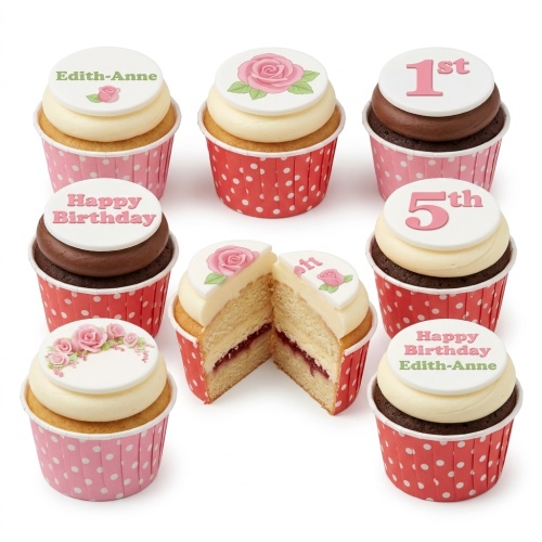 A selection of floral rose birthday cupcakes with custom age and name toppers in pink and red polka dot wrappers.