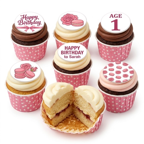 Assortment of pink and white birthday cupcakes with rose, macaron, and custom age toppers.