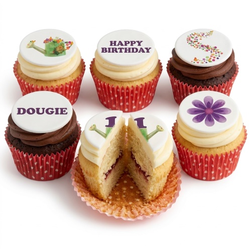 Assortment of floral and garden themed birthday cupcakes with custom toppers