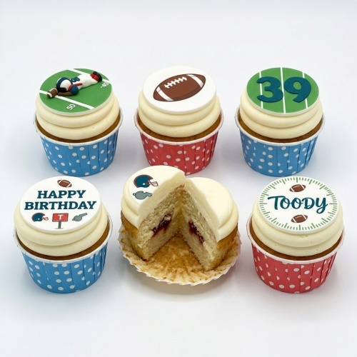 Assorted football theme birthday cupcakes with player, ball, field, and custom age toppers.