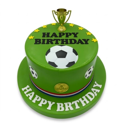 Green football birthday cake with gold trophy, stars, and footballs