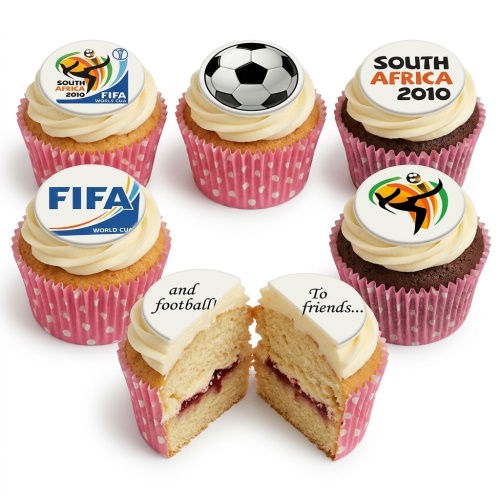 Set of football themed cupcakes with white and brown frosting, decorated with edible toppers featuring a black and white football, FIFA World Cup logo, and 'South Africa 2010' text.